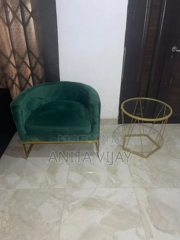 Luxury Emerald Green Velvet Accent Chair With Gold Side Table · Photo 1