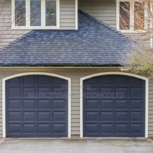 Original Insulated Garage Doors With Remote · Photo 1