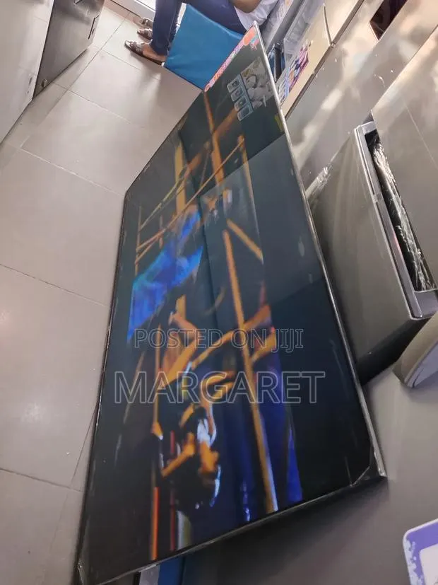 Uhd Smart Television Television With 2 Magic Remote · Photo 1