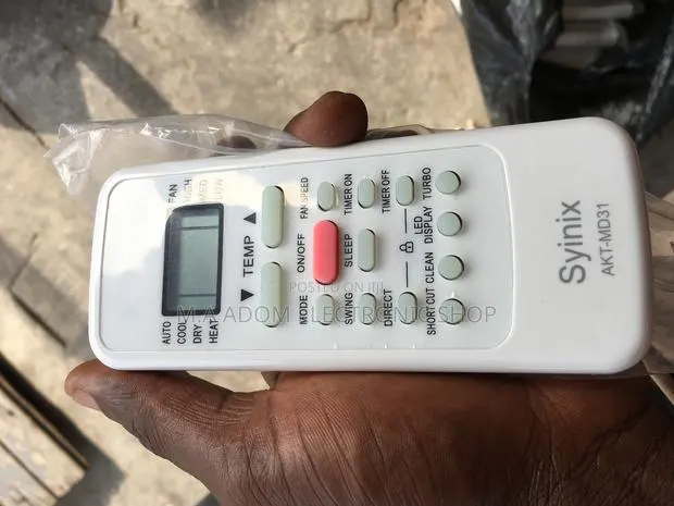 White Color With Red Power Bottoms Syinix Remote · Photo 1