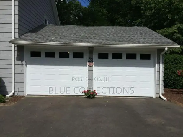 Morden Automated Garage Door With Fanlight · Photo 1