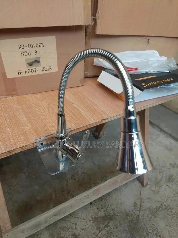 Modern Chrome Plated Flexible Hot and Cold Kitchen Faucet · Photo 1