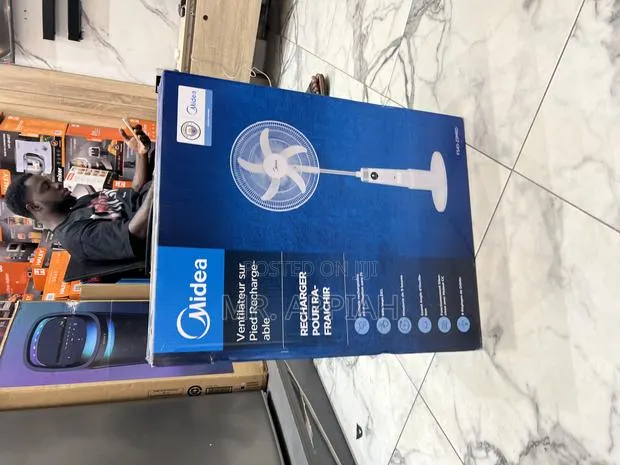 Order Affordable Midea 18” Rechargeable Standing Fan(White). · Photo 1