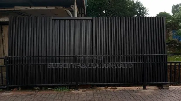 Sliding Gate With Small Door · Photo 1