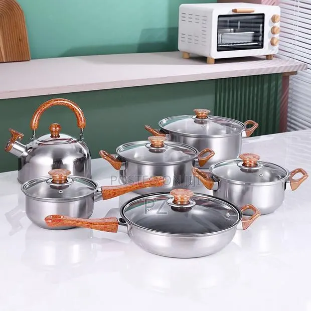 Stainless Steel Cookware Set With Wooden Grain Patterned Handles · Photo 1