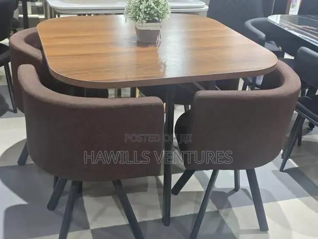 Modern Dining Set Features a Square Wooden Table With Dark Legs · Photo 1