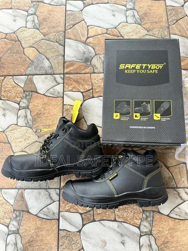 Steel Toe Safety Shoes Or Protective Work Boots · Photo 1