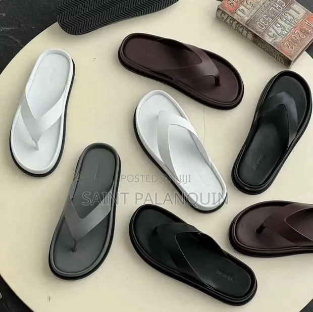 Minimalist Thick-Soled Thong Sandals in a Variety of Neutral Colors · Photo 1