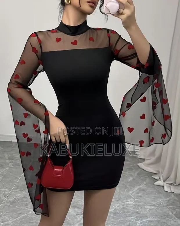 Elegant Black Bodycon Mini Dress With Heart Mesh Sleeves · Photo 1