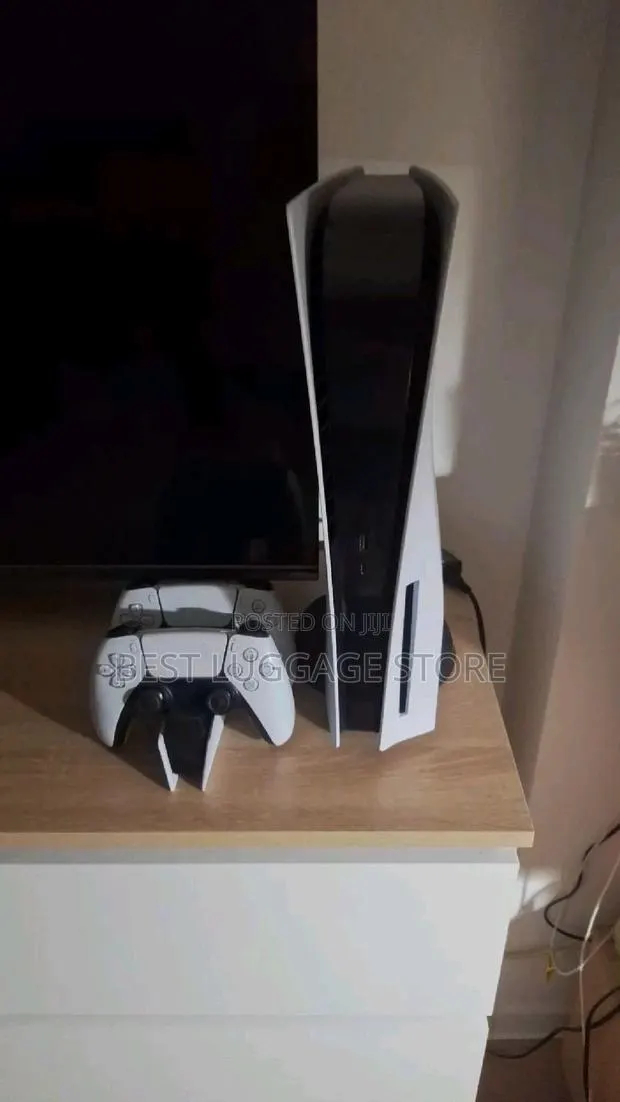 PS5 Standard With Two Controllers and Games Including Fc27 · Photo 1