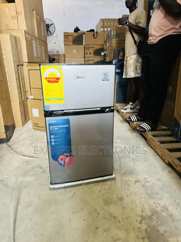 Text Us Fir the Dark Grey Double Door Table Top Midea Fridge · Photo 1