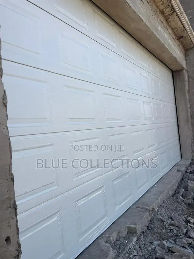 Garage Door With Motor,Two Remote and Ooener · Photo 1