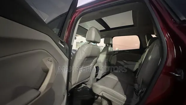 Ford Escape Titanium 4dr SUV AWD (1.6L 4cyl Turbo 6A) 2014 Red · Photo 1