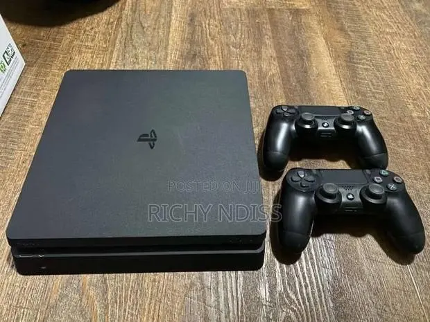 PS4 Slim 1TB With 2 Controllers & 8 Games " Jail Broken" · Photo 1