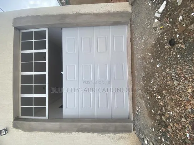 Automatic Garage Door With Fanlight · Photo 1