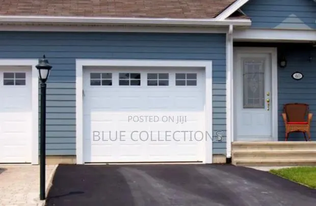 Canadian Garage Door With Fanlight · Photo 1