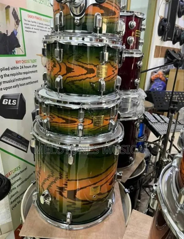 Tama Drumset With a Distinctive Green and Orange Tiger-Stripe Finish. · Photo 1