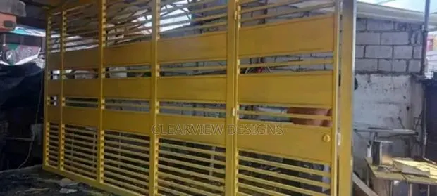 Uniquely Strong Yellow Sliding Gate · Photo 1