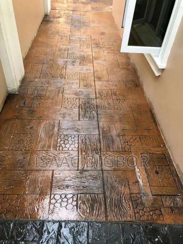 $ De Ike Construction Floor Stamping · Photo 1