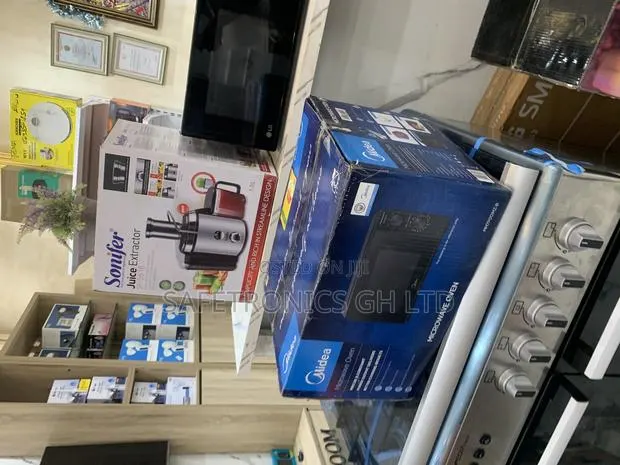 Try Brand New Midea 20ltrs Grill Microwave Silver · Photo 1