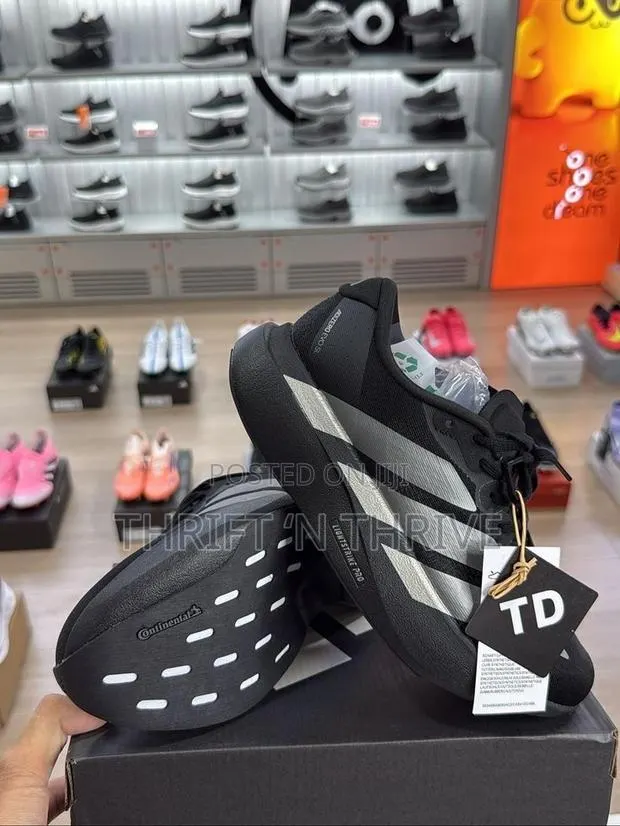 Adidas Adizero Evo SL Core Black Iron Metallic · Photo 1