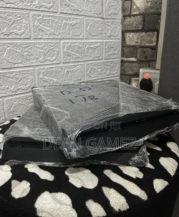 Ps4 Slim With Fc 26, Gta 5 and More Games With Accessories · Photo 1