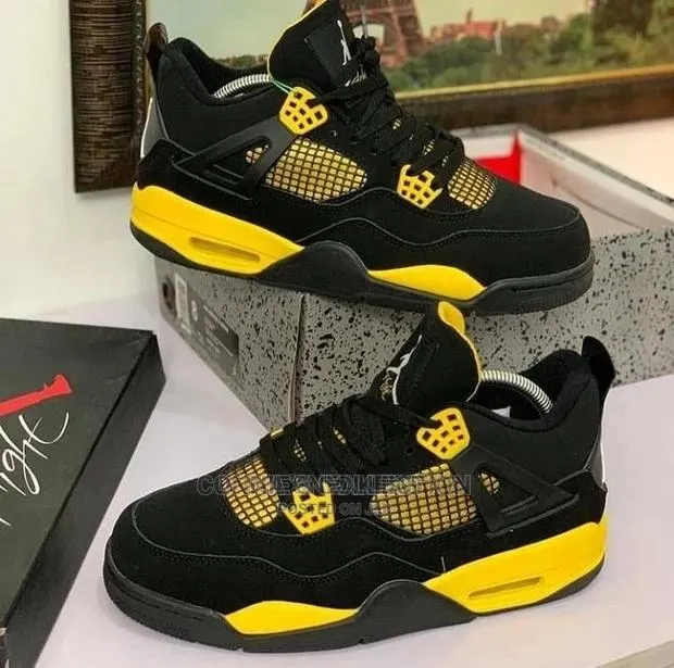 Air Jordan 4 Retro "Yellow/Red Thunder" · Photo 1