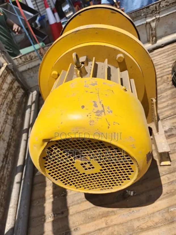 Heavy-Duty Yellow Electric Winch or Hoist Motor · Photo 3