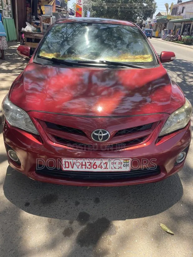 Toyota Corolla LE 4dr Sedan (1.8L 4cyl 4A) 2012 Red · Photo 1