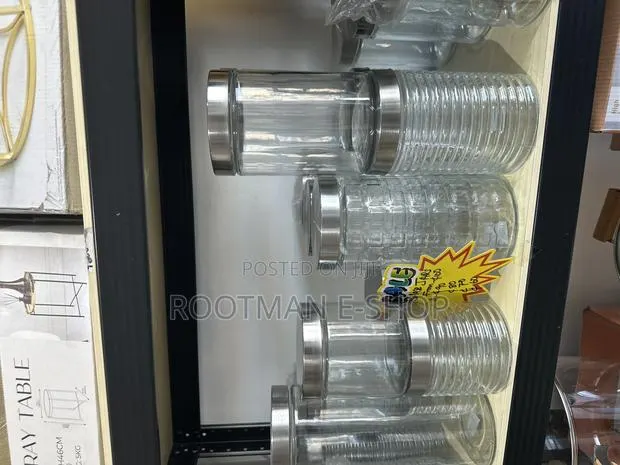 Clear Glass Food Storage Canisters Featuring Silver-Colored Metal Lids · Photo 1