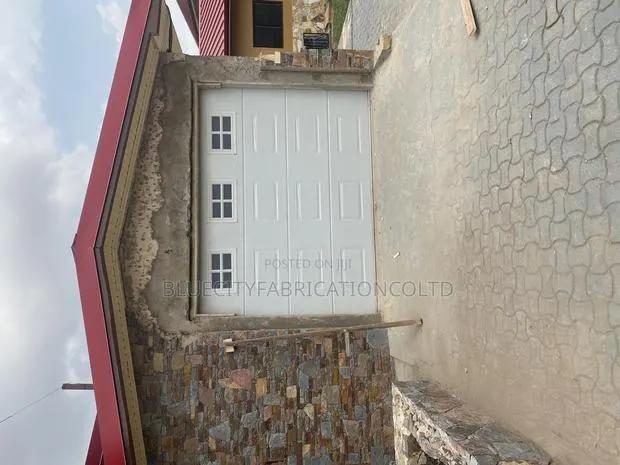 Imported Automated Garage Doors With Remote Fanlight · Photo 1