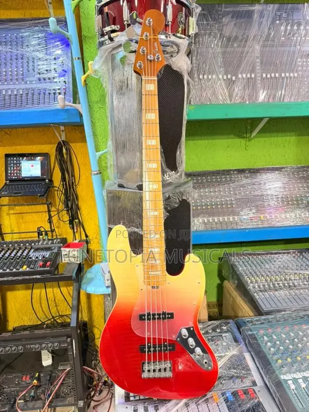 Fender Sqoe 5-String Electric Bass Guitar With a Sunrise Fade Finish. · Photo 1