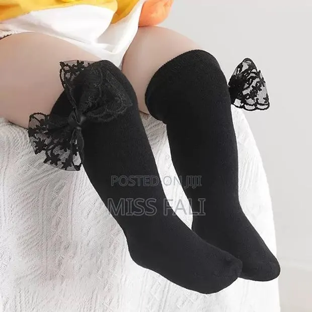 Knee High Lace Bow Socks. · Photo 1
