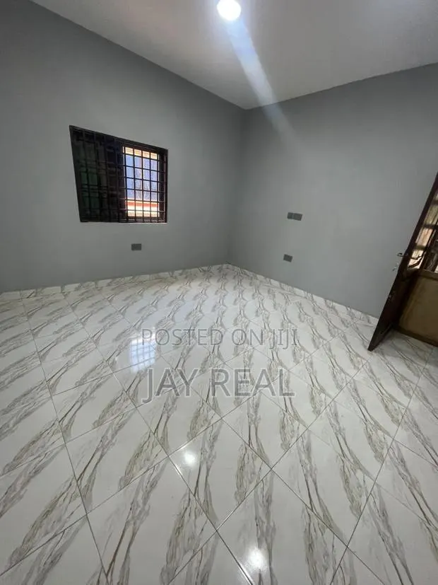 Road Side Plot With a Single Room Structure. · Photo 1