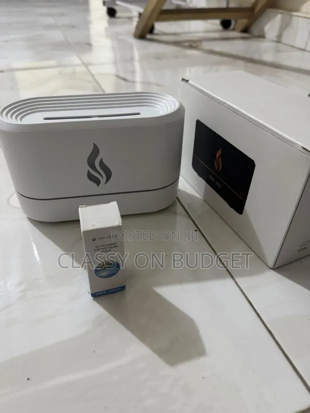 Flame Aromatherapy Device/Diffuser/ Humidifier With Free Fragrance · Photo 1