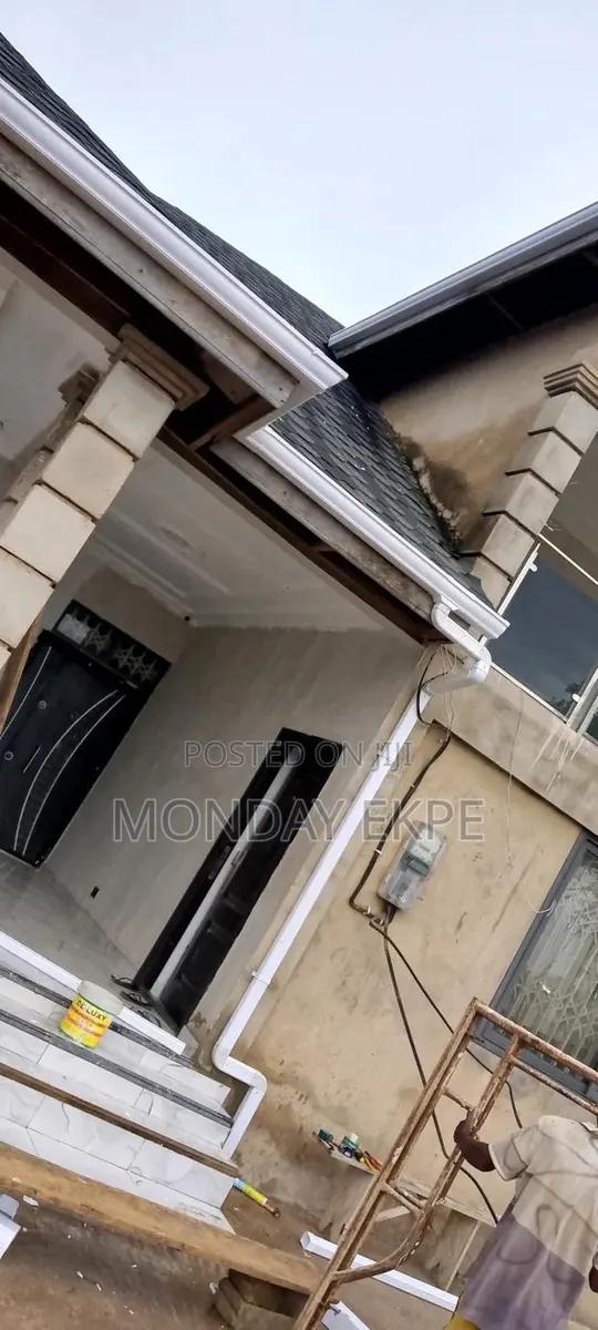 White PVC Gutter and Installation · Photo 1
