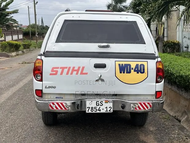 Mitsubishi L200 Double Cab 2.5 136hp 4WD 2012 White · Photo 1