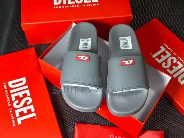 Grey Diesel Slide Sandals Featuring a Small Red "D" Logo on the Strap. · Photo 1