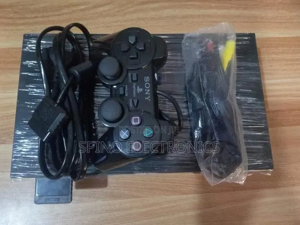 Play Station 2 (Ps2) Set Accessories With 20 Games · Photo 1