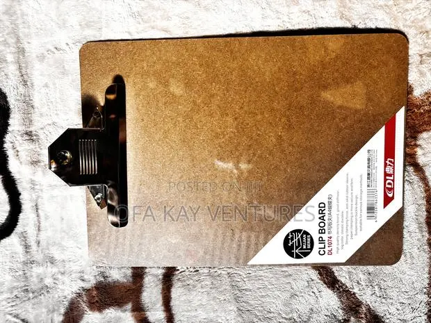 Clip Board With White Board Behind · Photo 1