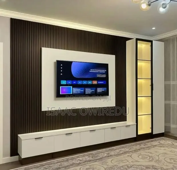 Television Wall Mounted Design With Panels and Lighting System · Photo 1