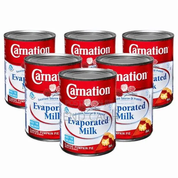 Carnation Evaporated Milk Vitamins C D Added 354ml (6 in a Pack) · Photo 1