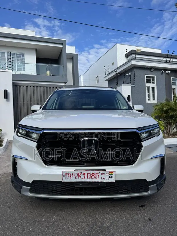 Honda Pilot Touring+ AWD 2025 White · Photo 1
