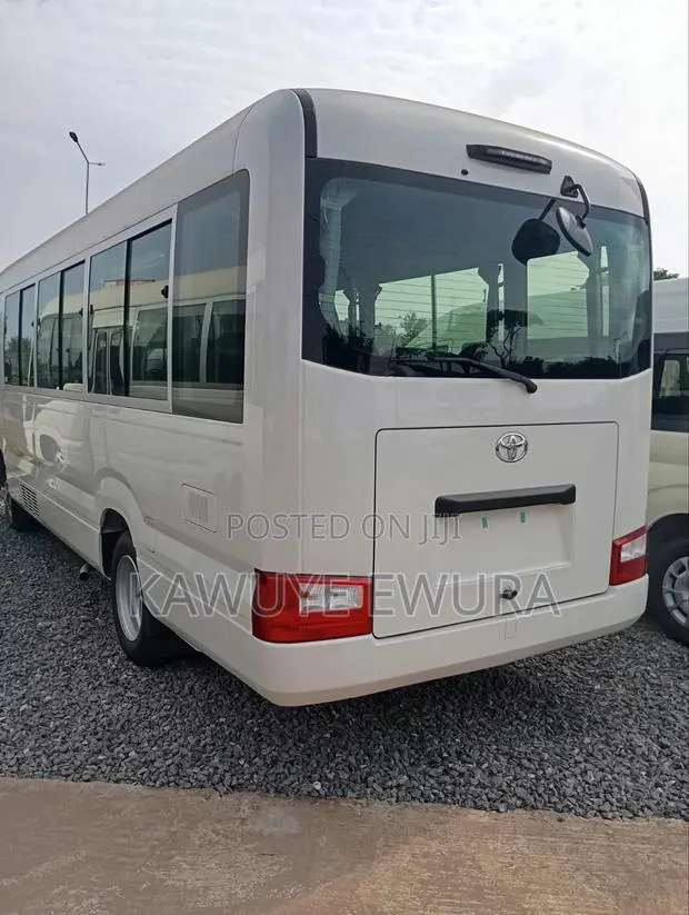 New Toyota Coaster 2025 White · Photo 1