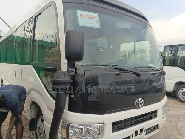New Toyota Coaster 2025 White · Photo 1