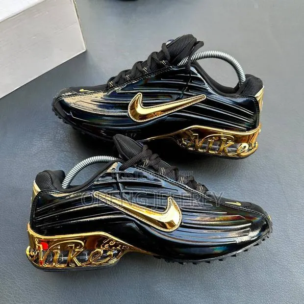 Original Nike Nocta Glossy Upper Black/Sole Metallic Gold · Photo 1