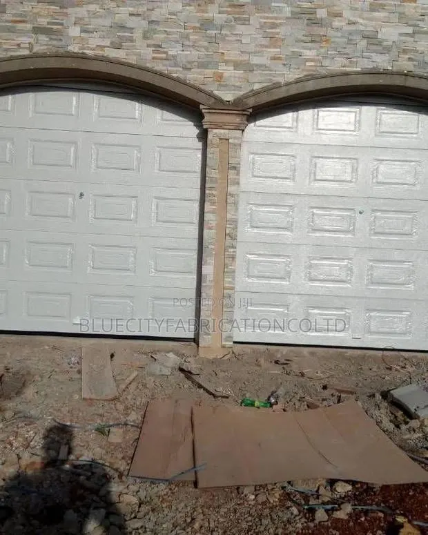 Black Automated Garage Door With Remote All Colors Available · Photo 1