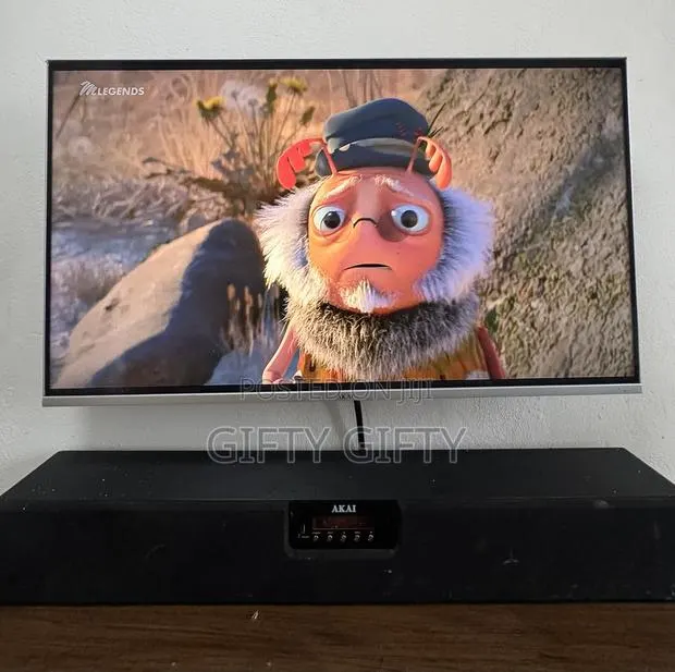 Television and Television Stand · Photo 1