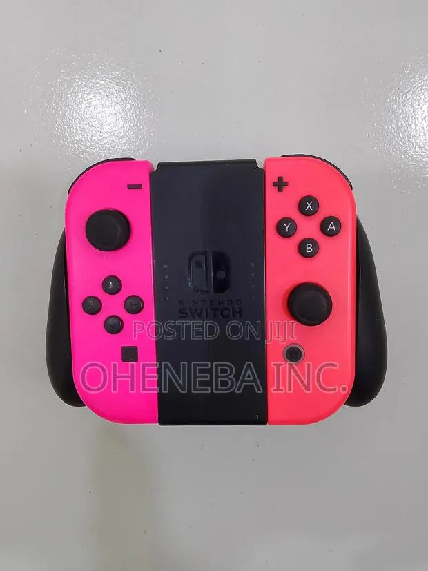 Nintendo Switch Joy-Cons + Holder · Photo 1