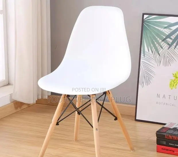 White Eames-Style Dining Chair With Wooden Legs · Photo 1